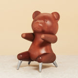 Brainchild – Træfigur – Bamse Figuren – Mahogni – Stål